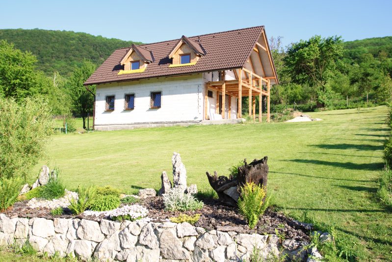 Unfinished new construction home in field